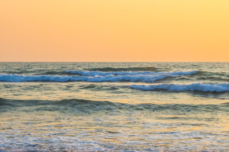 The beautiful sunsets of Paphos, Cyprus, setting on the horizon of the ocean waters of the Mediterranean.の写真素材