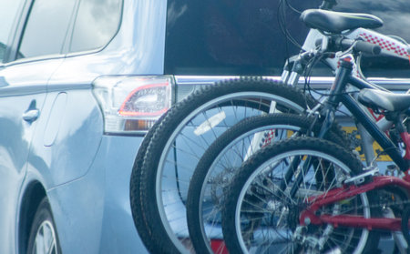 A vehicle carrying several bikes on the back of it to go on a holiday or a trip out somewhere.