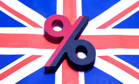A percentage symbol in front of a British flag.の写真素材