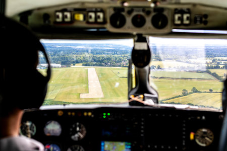 An aircraft landing or taking off from an airport tarmac runway.