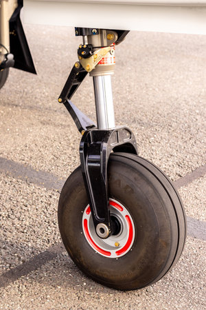 A small aircraft landing gear seen as an individual, i.e one side only.
