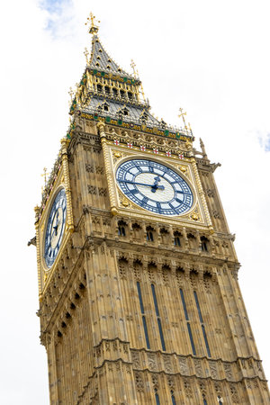 Big Ben, otherwise known as the Elizabeth Tower stands tall over London, United Kingdom. It's iconic...