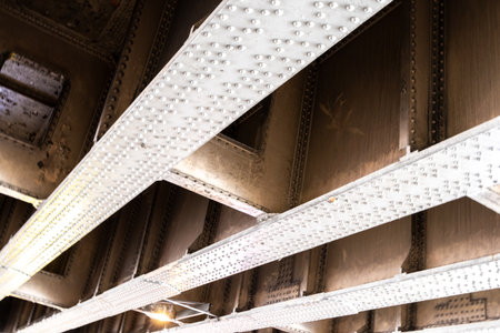 The River Thames is covered in various types, sizes and ages of bridges. Here seen a unique view from underneath just one of them.の写真素材