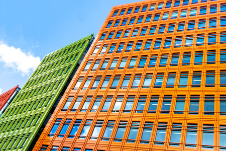 Buildings that have been designed with a bit of difference to the normal looking coloured buildings to bring a bit of brightness to a city.の写真素材