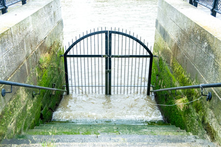 A historic set of steps leading down to the water level of the River Thames, in London.の写真素材