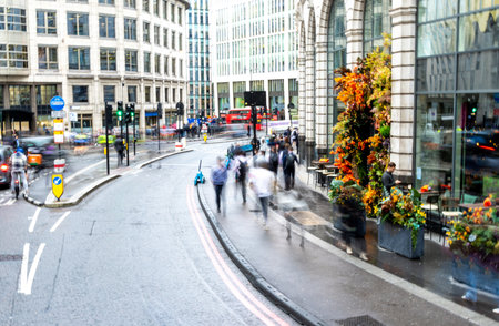 Rush hour seen with the blur of people walking around to and from their destinations, in London, United Kingdom.の写真素材