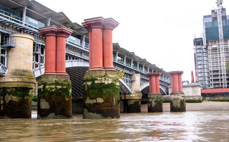 These large supports once were the stronghold of a previous bridge, located in London, UK.の写真素材