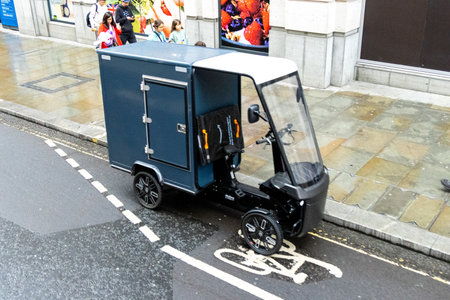An unusual piece of technology, an electric small vehicle used to get around the city to deliver items to companies and households.の写真素材