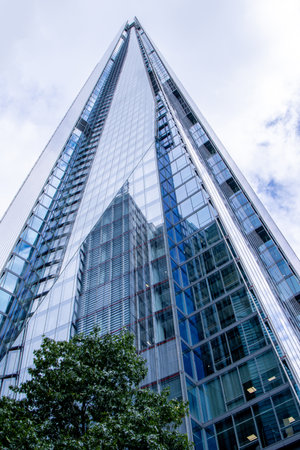 The Shard is a sharp skyscraper that stands tall over London, United Kingdom, visited by millions per year.の写真素材