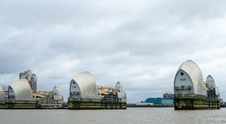 The River Thames flood defense barrier sits on standby if there should every be a significant rise in water level to protect the city of London, United Kingdom.の写真素材