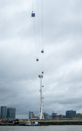 One of the unique ways to travel across London is to use the cable cars which take tourists and workers above and across the River Thames.の写真素材