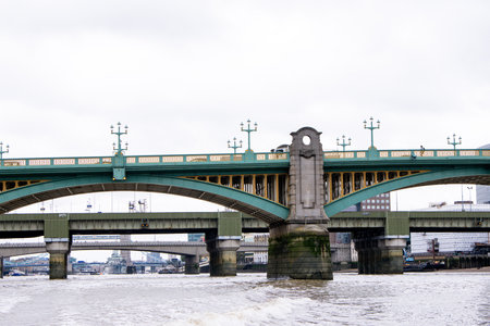The River Thames in London is covered in various bridge sizes and designs, old and new. Here just one of them seen from the River view.の写真素材
