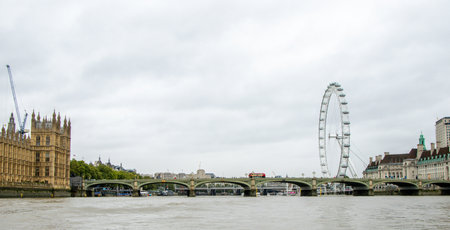 The River Thames, in London, is one of the most famous rivers in the World. Here seen a view looking along with various landmarks and buildings that surround it.の写真素材