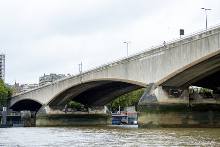 The River Thames in London is covered in various bridge sizes and designs, old and new. Here just one of them seen from the River view.の写真素材