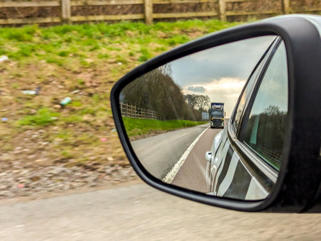 A large heavy goods vehicle travelling along a main road in the United Kingdom, on a journey to their next customer.の写真素材
