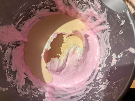 Hand casts made from alginate powder that has set to contain hand formations. Memories made from casting powder then poured into the pink casts.の写真素材