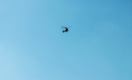 A helicopter with has multiple uses, here on this occasion it comes in to land to drop off or pick up it's passengers.の写真素材