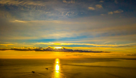 A view from above the English Channel where boats of all types pass through. Here seen with the sun setting creating beautiful colours.の写真素材
