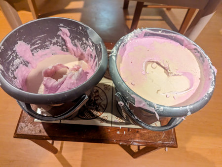 Hand casts made from alginate powder that has set to contain hand formations. Memories made from casting powder then poured into the pink casts.の写真素材