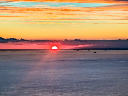A view from above the English Channel where boats of all types pass through. Here seen with the sun setting creating beautiful colours.の写真素材