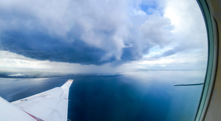 Bad Weather clouds seen from an aircraft approaching To Bring Heavy Rain And/Or Strong Winds. Typically dark or large clouds indicate heavy weather is inbound or passing by.の写真素材