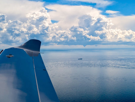 Bad Weather clouds seen from an aircraft approaching To Bring Heavy Rain And/Or Strong Winds. Typically dark or large clouds indicate heavy weather is inbound or passing by.の写真素材