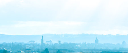 Glasgow, in Scotland, is a huge city. Here seen looking across the landscape with the hazy mist over the cityscape.の写真素材