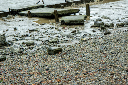 The River Thames has many small beaches along it's length, all in various conditions and sizes, here seen a small beach section.の写真素材