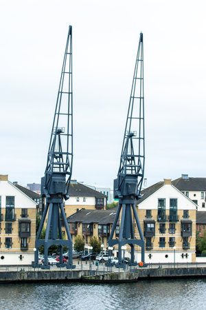 Large cranes uses to move heavy objects short distances and/or over static objects, like buildings, and onto other surfaces or to load.の写真素材