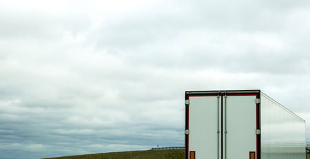 A large heavy goods vehicle travelling along a main road in the United Kingdom, on a journey to their next customer.の写真素材