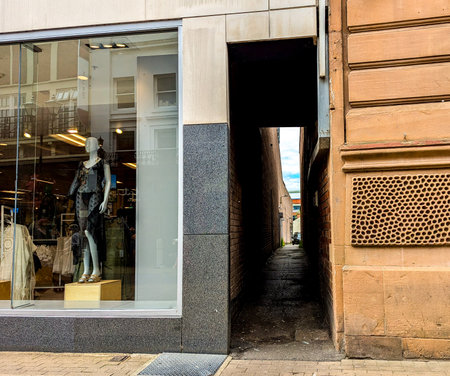 A long narrow alleyway for people to pass through usually found between buildings / property boundaries as quick access to the next area.の写真素材