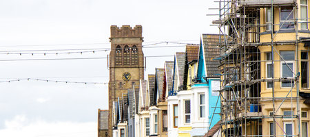 Terraced houses seen from the side, the properties open for rent or to be bought.の写真素材