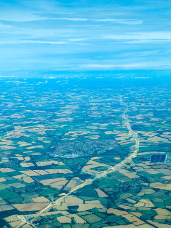 An aircraft flies over the route being laid for the HS2 train route between London and Birmingham.の写真素材