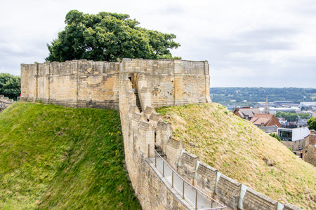 Lincoln Castle wall was once a defense from unwanted visitors, these days it's open to tourists and locals to walk around and enjoy the views from it.の写真素材