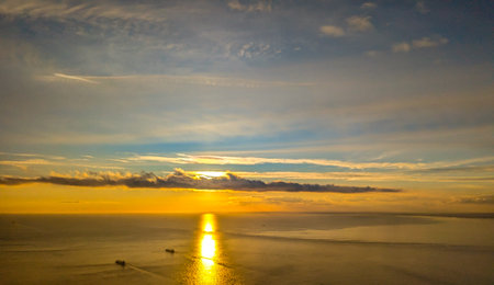 A view from above the English Channel where boats of all types pass through. Here seen with the sun setting creating beautiful colours.の写真素材