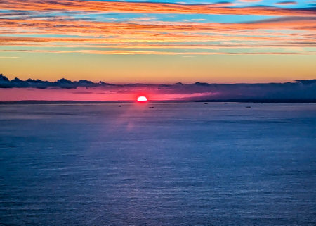 A view from above the English Channel where boats of all types pass through. Here seen with the sun setting creating beautiful colours.の写真素材