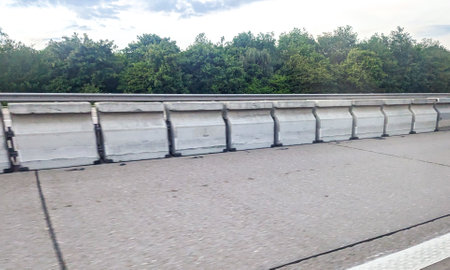 A motorway or dual carriageway central barrier protection to prevent further accidents. The barrier prevents vehicles crossing to oncoming vehicles.の写真素材