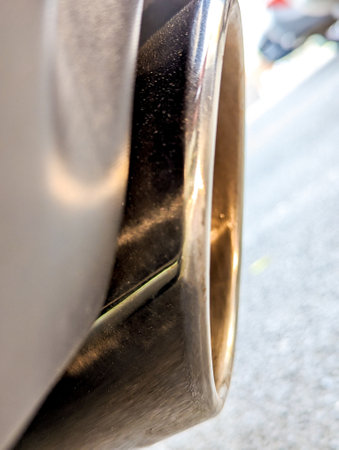 A new twin exhaust that has been fitted to a small sports car to produce more sound and more power, seen from beneath the vehicle.の写真素材