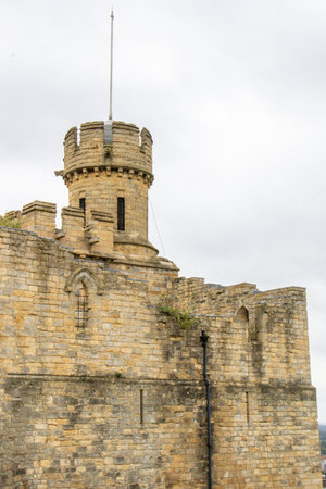 Lincoln Castle sits in the center of Lincoln city, visited by thousands of people every month. It's gothic architecture enjoyed by many.の写真素材