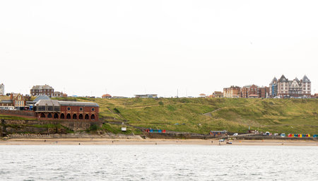 People staying in coastal hotels often request a sea view room so they can enjoy the views and weathers of the ocean. Here seen hotels perched on a cliffside.の写真素材