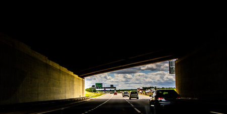 British roads are covered in various tunnels and bridges, here seen a vehicle within a tunnel about...