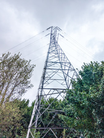 A common electricity pylon that supports electric cables over the land to supply properties of all sorts with electricity.の写真素材