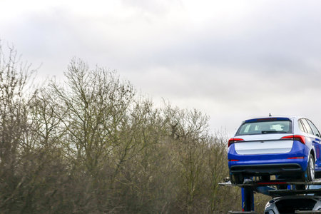A large car transported taking new vehicles to their sales garage forecourt via the motorways.の写真素材