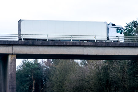 A large heavy goods vehicle travelling along a main road in the United Kingdom, on a journey to their next customer.の写真素材