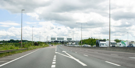 When travelling in the United Kingdom road users will often have this view of a motorway when driving to their destination.の写真素材