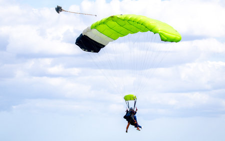 Skydiving is one of the most dangerous and adrenaline filled sports anyone can do. Here seen a skydiver coming into land.の写真素材