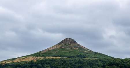 A very high mountain top which people climb for the views or for a challenge of some sort. Surrounded by beautiful land.の写真素材