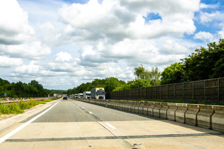When travelling in the United Kingdom road users will often have this view of a motorway when driving to their destination.の写真素材