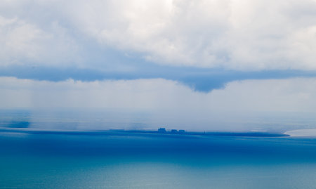 Bad Weather clouds seen from an aircraft approaching To Bring Heavy Rain And/Or Strong Winds. Typically dark or large clouds indicate heavy weather is inbound or passing by.の写真素材