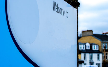A blank welcome sign that would typically have the name of the town or area that people are entering.の写真素材